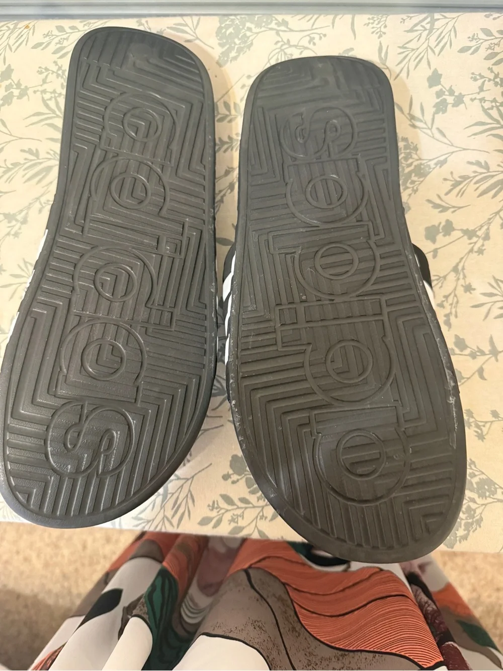 Adidas Adissage massage slides in classic black and white.